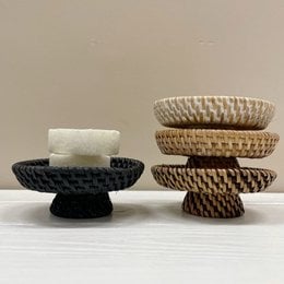 Round woven rattan bowls in natural, brown, white wash, and black colors. Handcrafted with intricate patterns and textures, suitable for serving or decorative use.