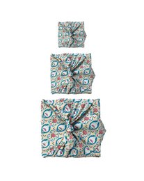 Furoshiki fabric gift wrap in a variety of vibrant colors and patterns including plum diamonds, gold moons, blush whales, burgundy arches, sky elephants, teal, jade, midnight snowflakes, ruby, midnight reindeers, make a wish, sunshine nouveau, ocean, and art deco designs.