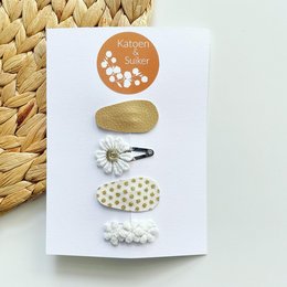 Mix leather 3cm dotted gold hair clips for kids. Features a round gold-dotted design, a daisy flower, and a polka dot pattern.