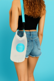 Waterproof and transparent dry bag with a roll-up closure and adjustable shoulder strap, available in the color blue.
