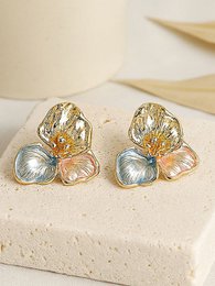 Gold-toned multi-color floral stud earrings with post-back closure, decorative design with mixed metal finish.