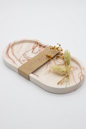 Oval marble decorative tray in earth-toned colors with a natural, organic design.