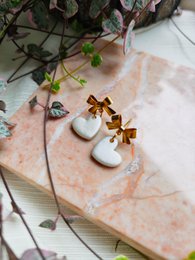  White pearl heart-shaped earrings with gold bow studs, delicate statement jewelry