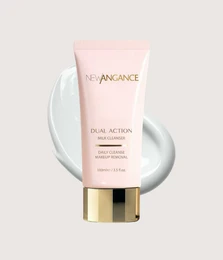 Pink dual action cleansing milk, gentle facial cleanser with gold cap, skincare product.