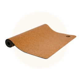 A cork yoga mat with a textured surface and a round button detail.