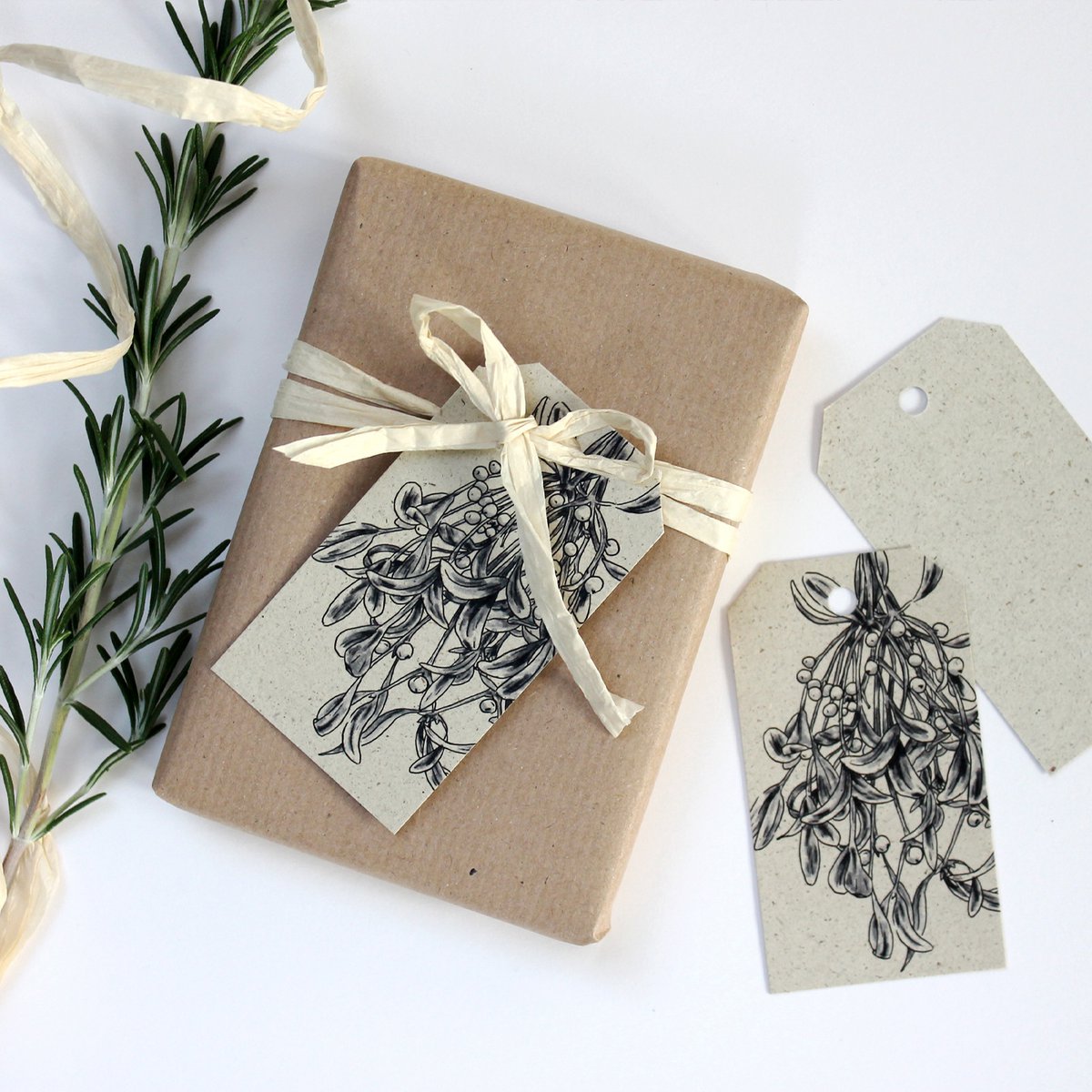 Gift tags made from grass paper, mistletoe