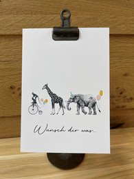 Whimsical postcard with illustrated animals and the text "Wünsche dir was" (Wish for something).