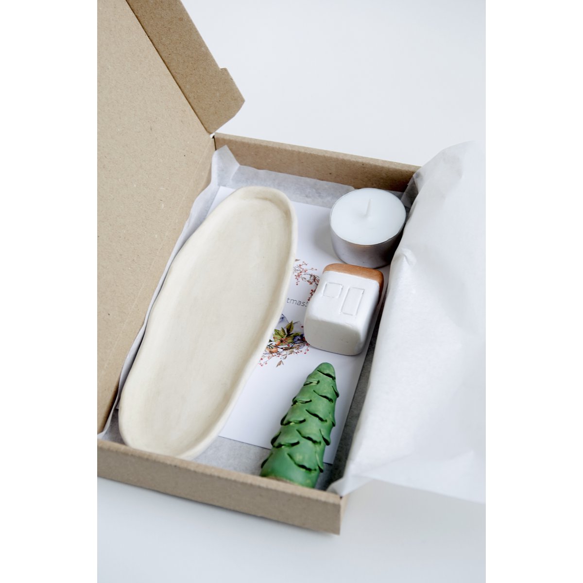 Christmas Giftbox with house, tree and candle
