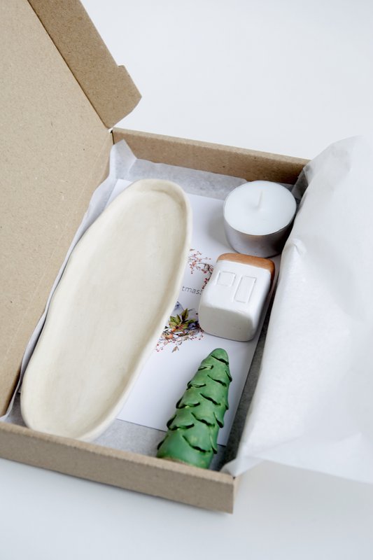 Christmas Giftbox with house, tree and candle