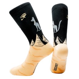 Black socks with white silhouettes of pyramids and camels against a desert landscape.