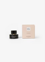 Floral fragrance with notes of jasmine, rose, and sandalwood. Elegant glass bottle with black cap.