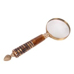 A wooden magnifying glass with a decorative handle and a round, magnifying lens. The handle is made of dark wood with a spiral pattern.