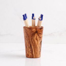 Handmade olive wood pencil holder, natural wood grain texture, cylindrical shape, rustic desk organizer, wooden desk accessory
