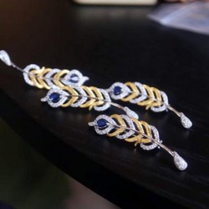 Gevederde pracht saffier broche