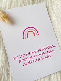 Colorful rainbow-shaped card with Dutch text about living life to the fullest. The card features a vibrant rainbow design in red, pink, and orange hues.