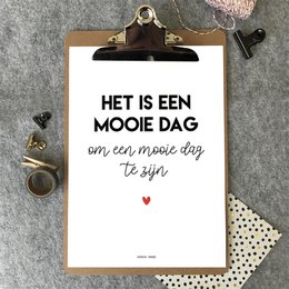 A poster with a simple, minimalist design featuring a Dutch text that translates to "Heel erg dicht bij jou is mijn favorite plek" or "Being very close to you is my favorite place". The poster has a neutral color palette and a heart symbol, creating a warm and affectionate sentiment.