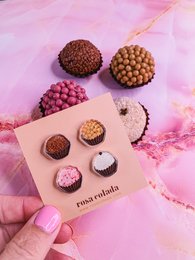 Stud earrings from the Brigadeiros Collection, featuring a variety of round, textured, and patterned designs in shades of brown, pink, and gold.