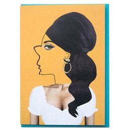 Greeting card featuring a stylized profile of a woman with long, dark hair against a yellow background. The card has a quote about the fantasy of a man being the best weapon of a woman.