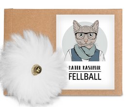 Soft, fluffy white sheepskin fur ball cat toy, handcrafted in Germany, durable and sustainable for your feline friend's playtime.