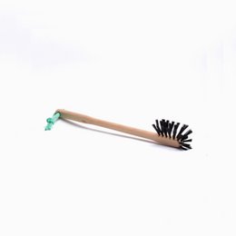Compact travel brush with soft bristles for cleaning bottles and containers on the go.