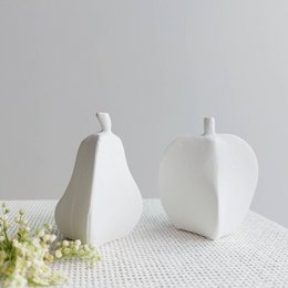 Decorative white pear-shaped figurines, set of 4 pieces.