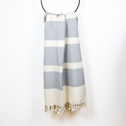 Hammam towel organic cotton Dalya light grey - A lightweight, organic cotton hammam towel in a light grey color with striped pattern and tasseled edges.