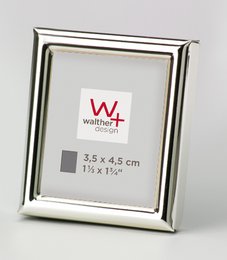 Silver-colored metal frame with a simple, elegant design. Suitable for displaying 3.5 x 4.5 inch photographs or artwork.