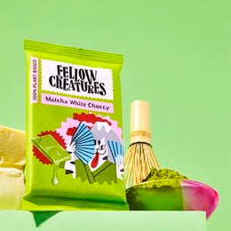 Matcha white chocolate snack bar with a vibrant, colorful package design featuring abstract shapes and patterns.