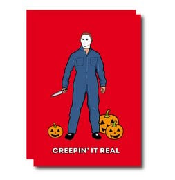 A Halloween greeting card featuring a character in a blue jumpsuit holding two jack-o'-lanterns against a bright red background with the text "Creepin' It Real".
