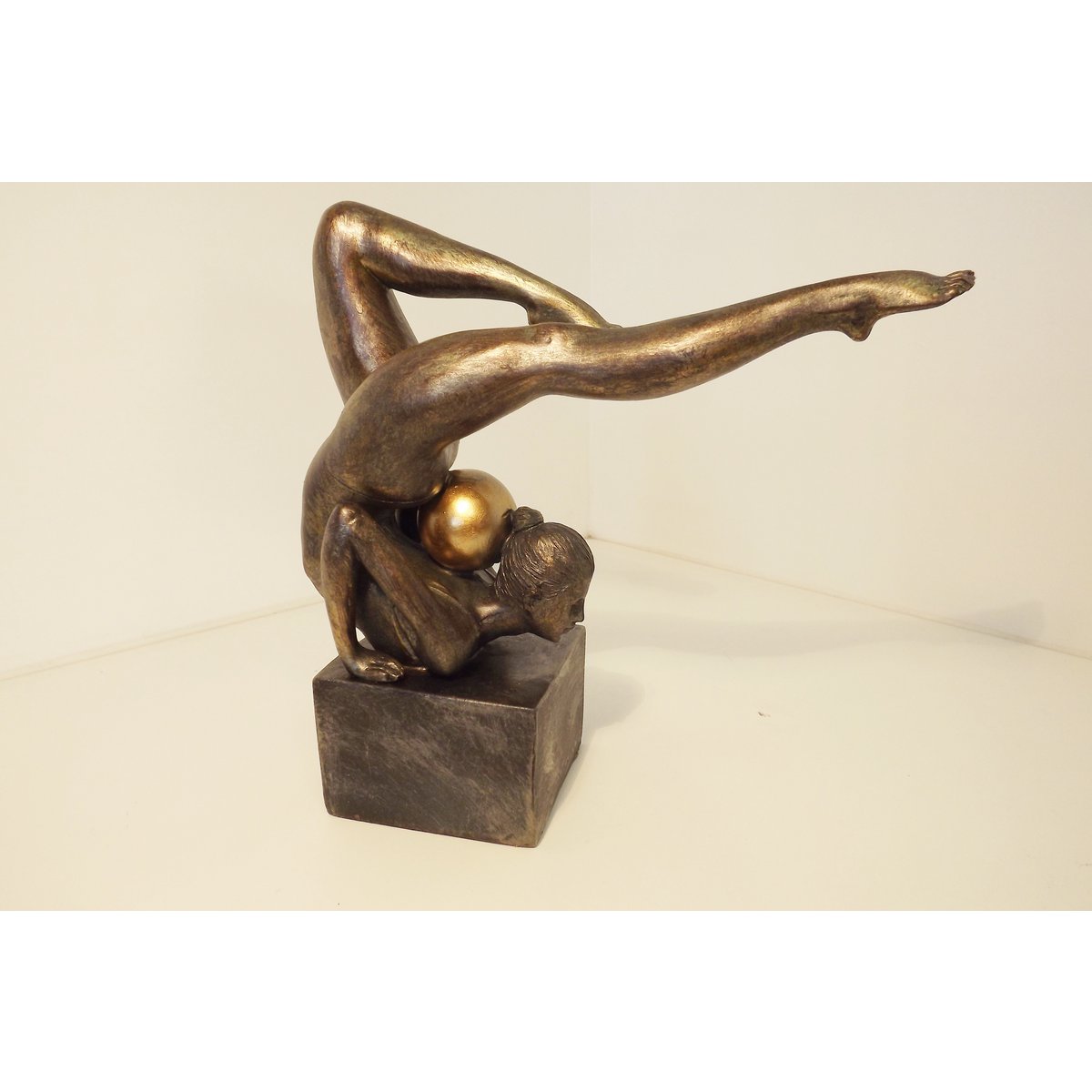 Gymnast with gold ball on her neck