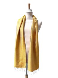 A long, rectangular scarf made of a soft, golden-yellow material with a subtle textured pattern. The scarf has fringed edges and appears to be a lightweight, versatile accessory suitable for various occasions.