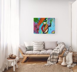 Colorful abstract wall art featuring a whimsical, smiling character with vibrant orange, green, and blue hues.