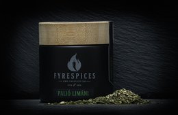 Seasoning blend in a black container with the brand name "PALIÓ LIMÁNI" displayed. The seasoning appears to be a mixture of dried, crushed herbs and spices with a vibrant green color.