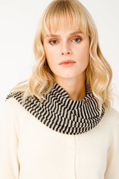  Black and beige striped scarf made of soft, lightweight material.