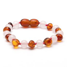 Amber and rose quartz bracelet for kids, featuring round amber and rose quartz beads in a stretchy design.