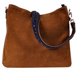 Suede shoulder bag in cognac color with a sapphire blue strap and beaded detailing.