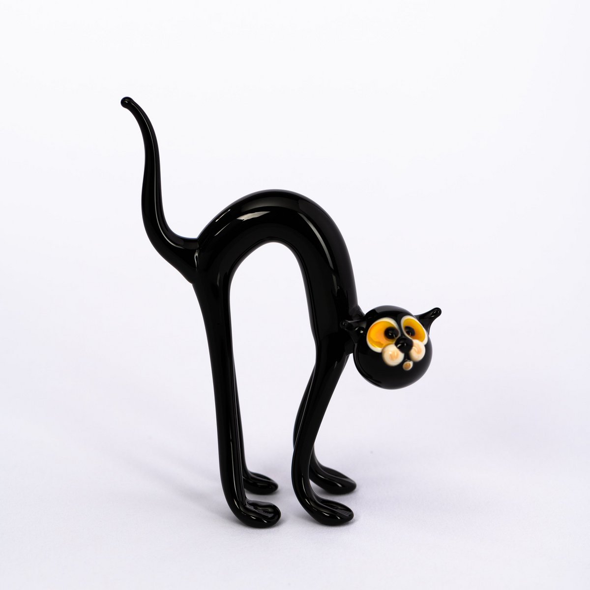 Cat with humpback glass animal