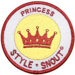 Circular patch with a crown and text "PRINCESS STYLE SNOUT" in red and yellow. Appears to be a decorative pet collar or accessory.