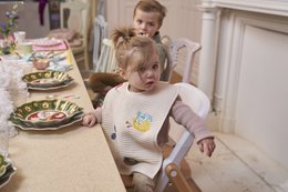 Large bib with colorful animal print design, suitable for toddlers and infants.