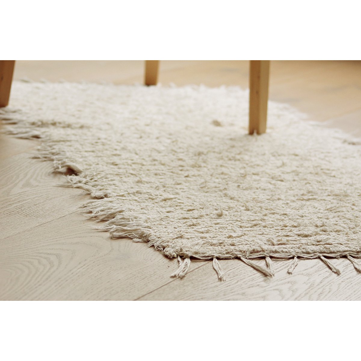 Klein crèmekleurig katoenen vloerkleed van 100/50 cm