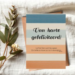 A greeting card with the Dutch text "Van harte gefeliciteerd!" which translates to "Congratulations!" The card has a simple, elegant design with a blue and orange color scheme.