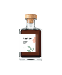 A 200ml bottle of Condimento Balsamico di Mela, a balsamic vinegar of apple. The bottle has a cork stopper and a brown liquid inside.