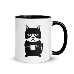 A white ceramic mug with a black grumpy cat design. The cat is holding a coffee mug, expressing a grumpy or displeased expression.