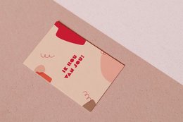 Colorful greeting cards with the text "Ik Hou Van Jou!" in red and white on a beige background.