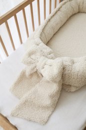 Babynest met strik/boucle babynest - 2 kleuren Exemplaar