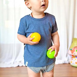 This product is a navy blue organic baby short sleeve t-shirt with a striped bottom. The t-shirt is made of soft, breathable organic cotton and features a simple, classic design. It is suitable for babies aged 0-24 months.