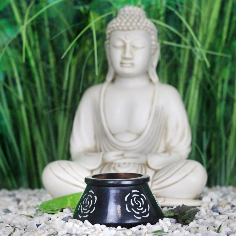 Tea light holder made of soapstone including tea light