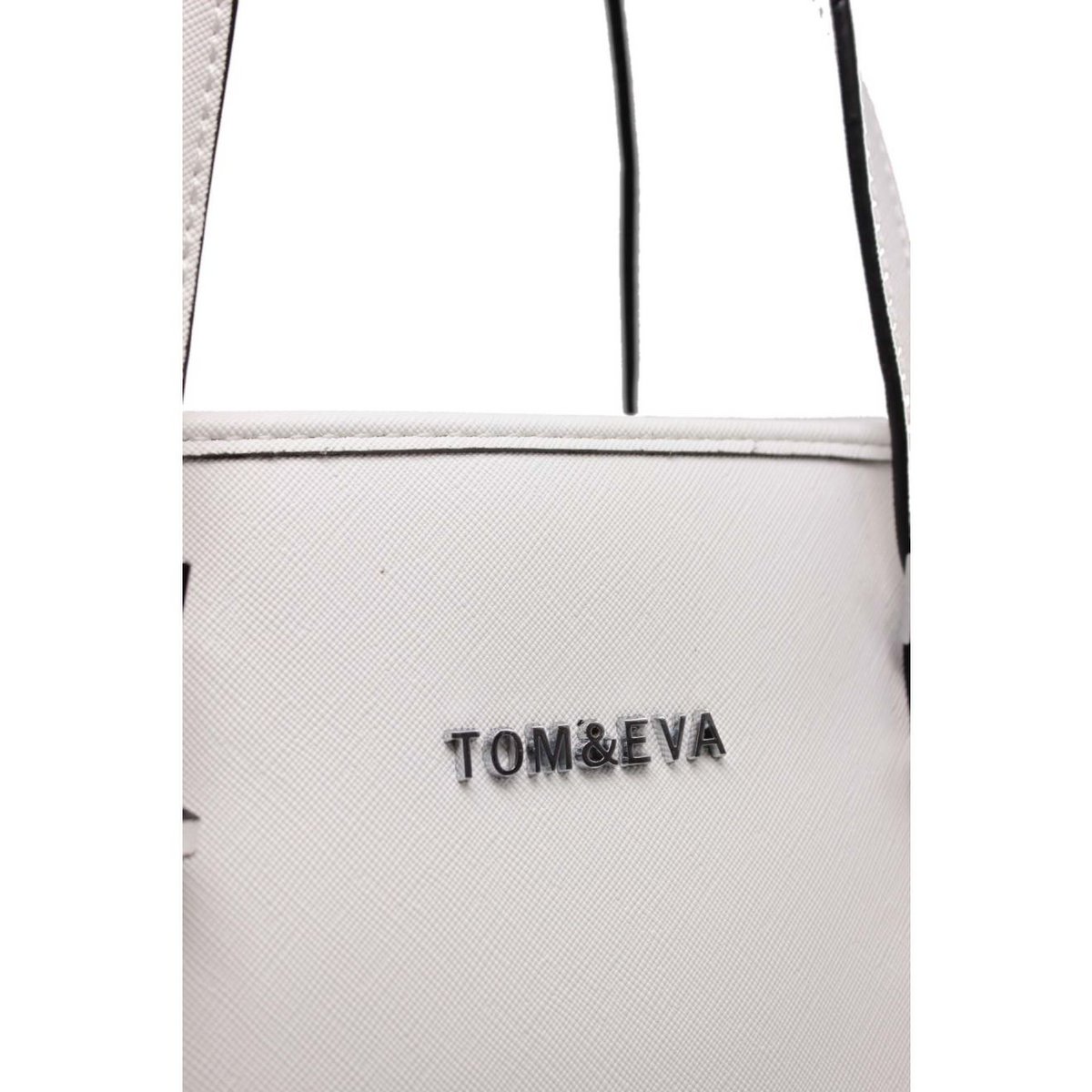 Tom y Eva Eva – Compradora