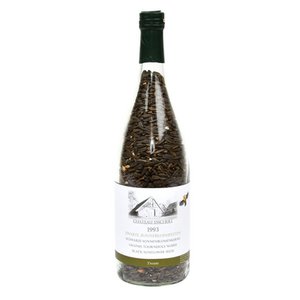 Wine bottle with black sunflower seeds