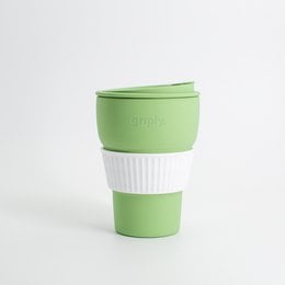 Foldable coffee cup in summer green color, made of durable materials, with a capacity of 355 ML. Suitable for on-the-go use.